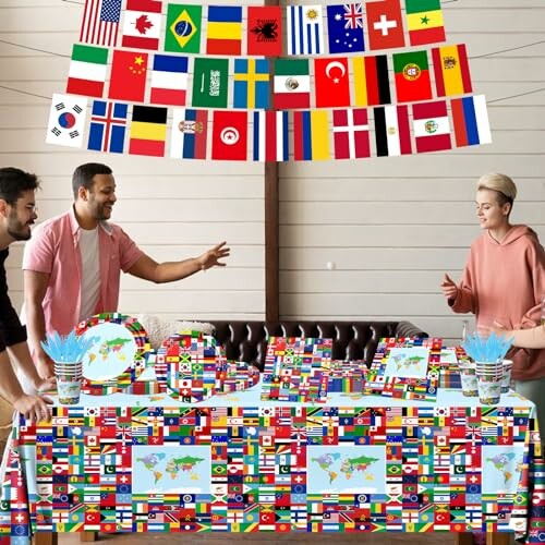 People at a table decorated with international flags.