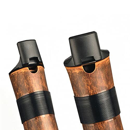 Two woodwind instrument mouthpieces with dark brown and black accents.